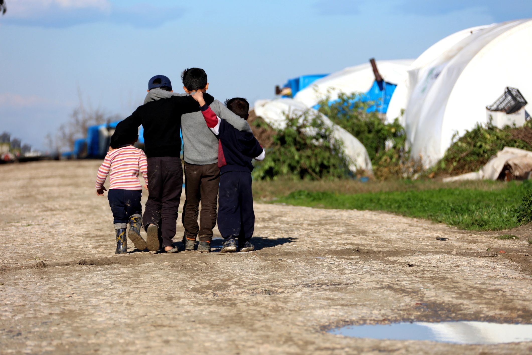 Children in refugee camp walking together